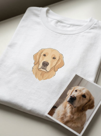 A pet portrait printed in full colour on a white t-shirt, with the owner's own photo of the golden retriever printed and lying beside it